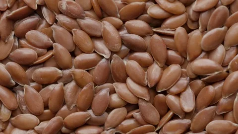 Close up of raw flaxseeds rotating in а circle UNGRADED Stock Footage 119848034
