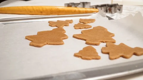 Close up of raw gingerbread cookies are on the baking sheet Stock Footage 99156901