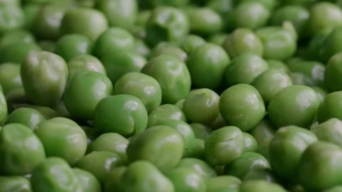 Close up of raw green peas in motion UNGRADED Video stock 119895709