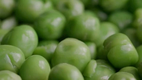 Close up of raw green peas in motion UNGRADED Stock Footage 119896268