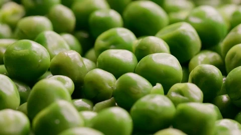 Close up of raw green peas rotating Stock Footage 119895032