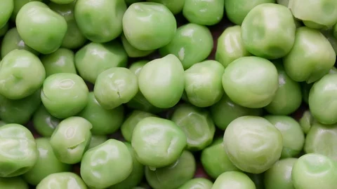 Close up of raw green peas rotating in а circle UNGRADED Stock Footage 119896255