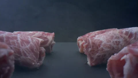 Close-up raw hot pot meat on a black background Stock Footage 157843192