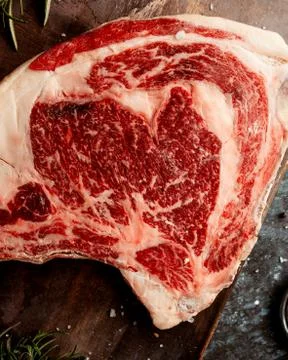 Close up of raw lamb meat placed on wooden board Stock Photos