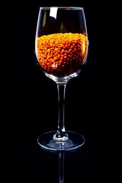 Close up of Raw Masur dal or masoor lentils or pink lentils in a black colore Stock Photos