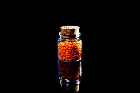 Close up of Raw Masur dal or masoor lentils or pink lentils in a black colore Stock Photos