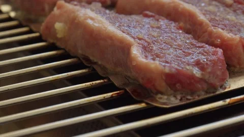 Close up of raw meat on a hot grill Stock Footage 130266822