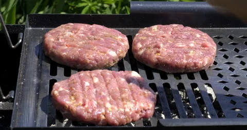 Close-up of Raw Minced Meat. Chef Throws Third Piece onto Grill. Heat from Coals Stock Footage 132336653