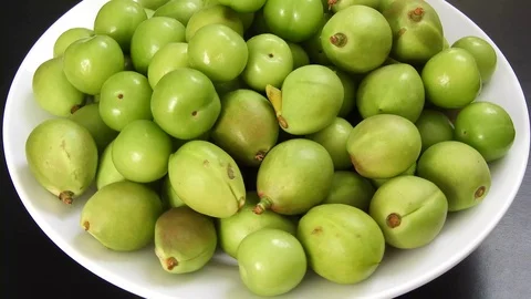 Close-up raw nectarine and sour plum on the rotating stand, Stock Footage 129856723