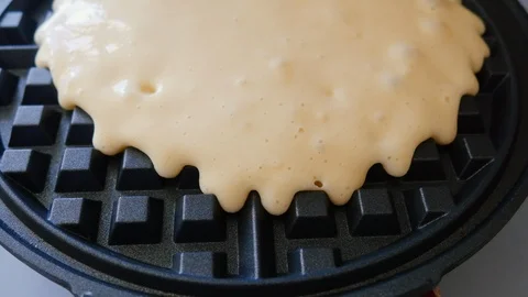 Close up of Raw Pastry Batter Cooking in a Waffle Iron in 4k Stock Footage 86485115
