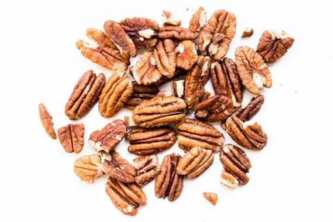 Close up of raw pecan nuts on white background Stock Photos