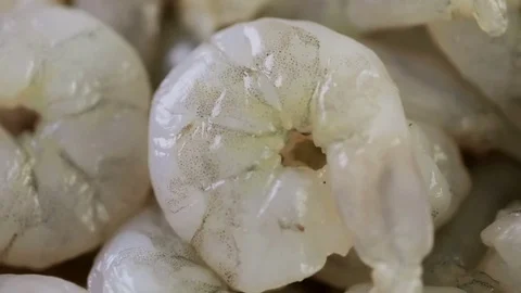 Close up of raw peeled shrimp on a brown butcher paper. Stock Footage