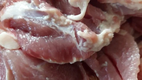 Close up of raw pork neck meat with fat marbling Stock Footage 334393168