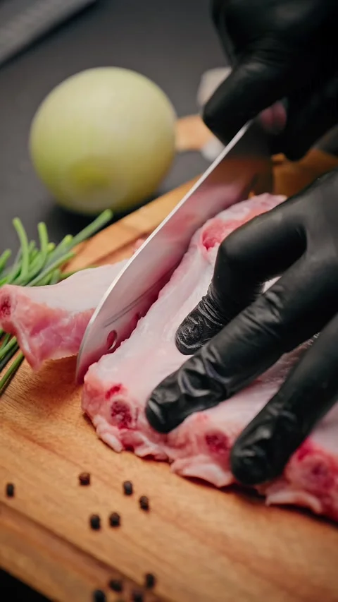 Close-up of raw pork ribs with tomatoes and spices Stock Footage 314606786