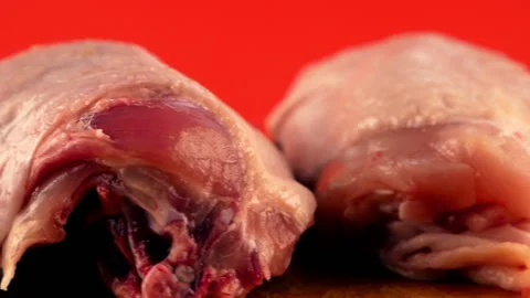 Close-up of raw poultry meat rotates. Chicken thighs are fresh. Diet meat prepar Stock Footage 143955322