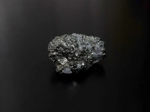 Close-up of a raw pyrite specimen with sharp cubic crystals Stock Photos
