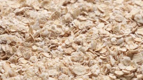 Close up of raw rolled oat flakes texture as a healthy breakfast cereal Stock-Footage 347459317