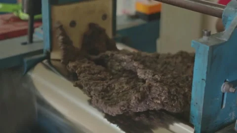 Close-up of Raw Rubber Material Compounding and Refining Process Stock Footage 336712965