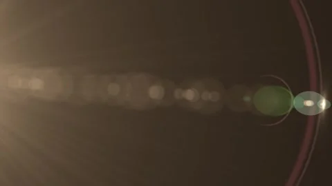 Close up of rays of sunlight with lens flare and bokeh effect in warm tones 스톡 동영상 337226361