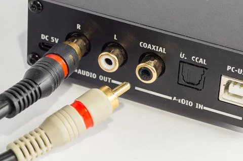 Close-up of RCA connectors plugged into an audio device. Stock Photos