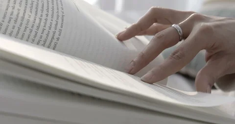 Close up reading at home next to the window - 4K Stock-Footage 96313041