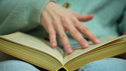 Close up reading paper book, turning page. Slow Motion Stock Footage 236316720