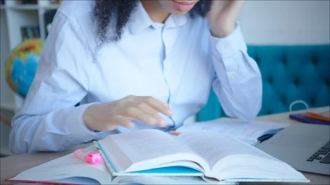 Close up reading textbook and making marks in the library Stock Footage 104413290