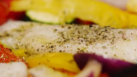 Close-up of ready to bake wild caught atlantic Cod fillets with mediterranean Stock Footage 328832736