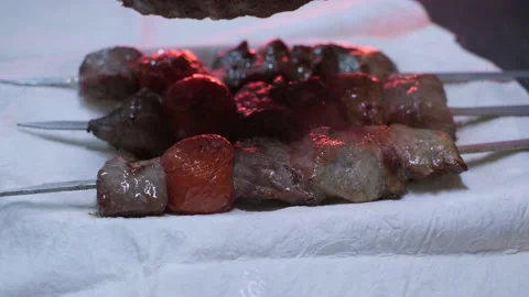 Close-up of ready lumpy kebab with tomato and ground kebab Stock Footage 204871100