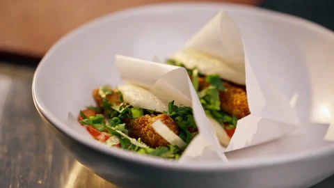 Close-up of ready-made buns with shrimp and vegetables in paper packaging laid Stock Footage 273168059