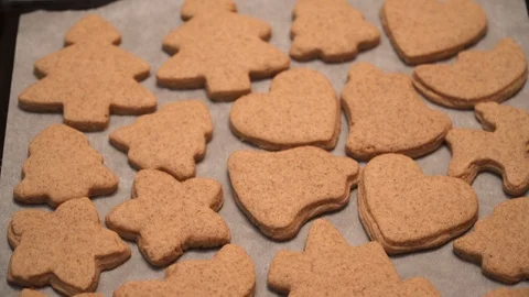 Close-up of ready-made gingerbread cookies are lying on the table  Stock Footage 99156942