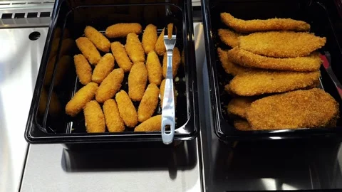 Close-up of ready-made hot patties and chops in containers in the kitchen. Stock Footage 341550374