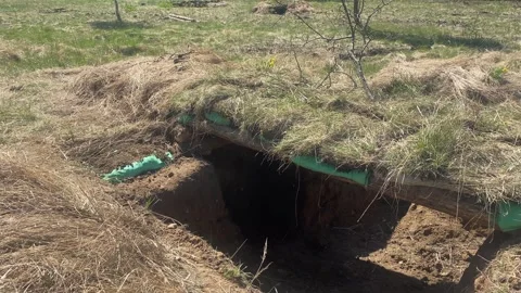 Close up ready trenches with hay stacks and grass camouflage in forest outd.. Stock Footage 244813394