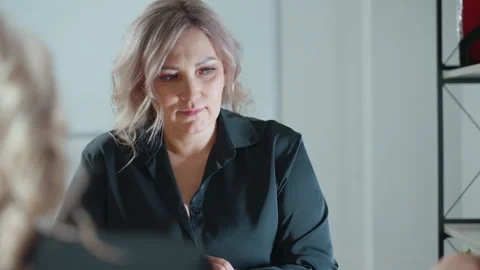 Close up real estate professional explaining project to client in office setting Stock Footage 310811357