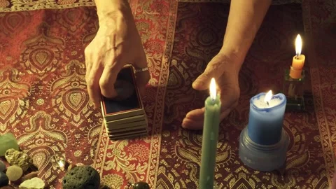 Close-up of a real tarot reader's hands predicting the future with tarot Stock Footage 259143549