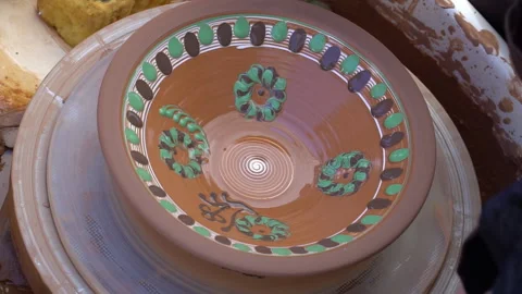 Close up real time shot of hands painting  ukrainian pattern on glased  cla.. Stock Footage 255147939