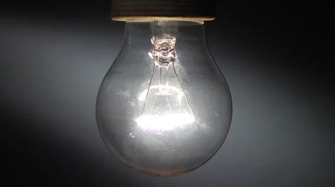 Close up of real tungsten lamp blinks on window light background Stock Footage 47649619