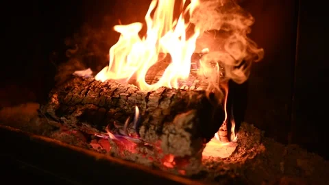 Close-Up Of A Real Wood Fire Burning In A Brick Fireplace, Slowmotion Stock Footage 263887927