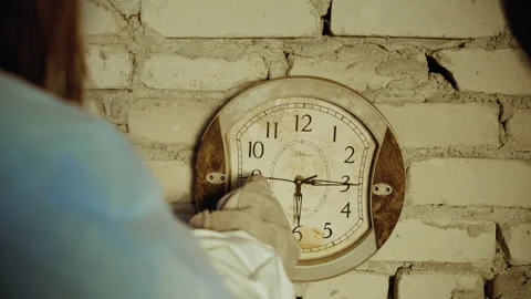 Close Up Rear View Hand Adjusting Old Wall Clock Video stock 329464015