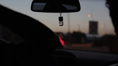 Close-Up Of Rear-View Mirror, Driving at Sunset Stockbeeldmateriaal 119449655