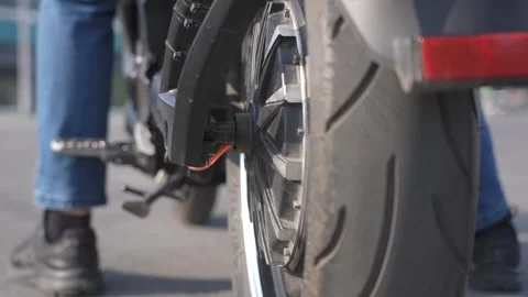 Close-up of the rear wheel with the engine of an electric motorcycle. Stock Footage 257814219