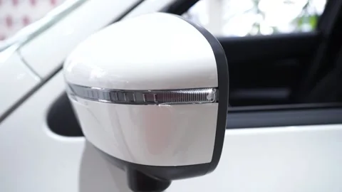 Close up of a rearview mirror of modern blue car with flashing turn signal Stock Footage 169029619
