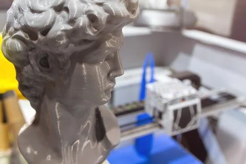 A close-up of a recently 3D-printed bust of an ancient man showing Stock Photos