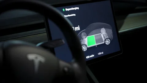 Close up of the recharging process inside the Tesla electro mobiles. September Stock Footage 318048821