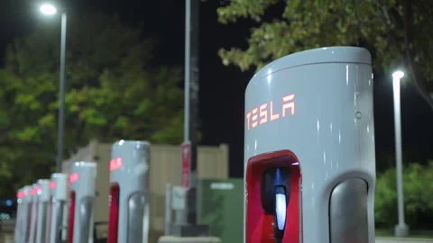 Close up of the recharging Tesla stations for electro mobiles at night Stock Footage 318365224