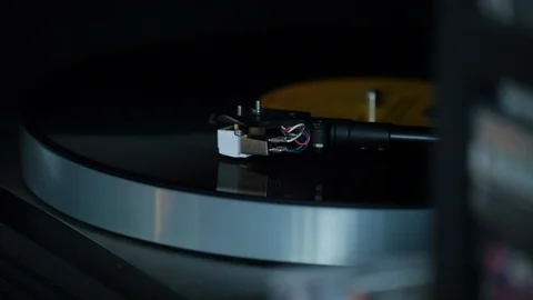 Close up of record player arm as LP plays Stock Footage 98740859