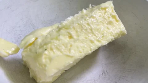 Close-up of a rectangular block of butter resting in a white dish, ready fo.. Stock Footage 314218315
