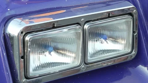 Close-up of rectangular dual headlights with chrome trim on truck. Stock Footage 341137399