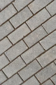 Close-up of rectangular grey brick wall made of composite material 스톡 사진