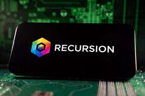 Close up of Recursion logo on device with circuit board background. Toronto, Stock Photos